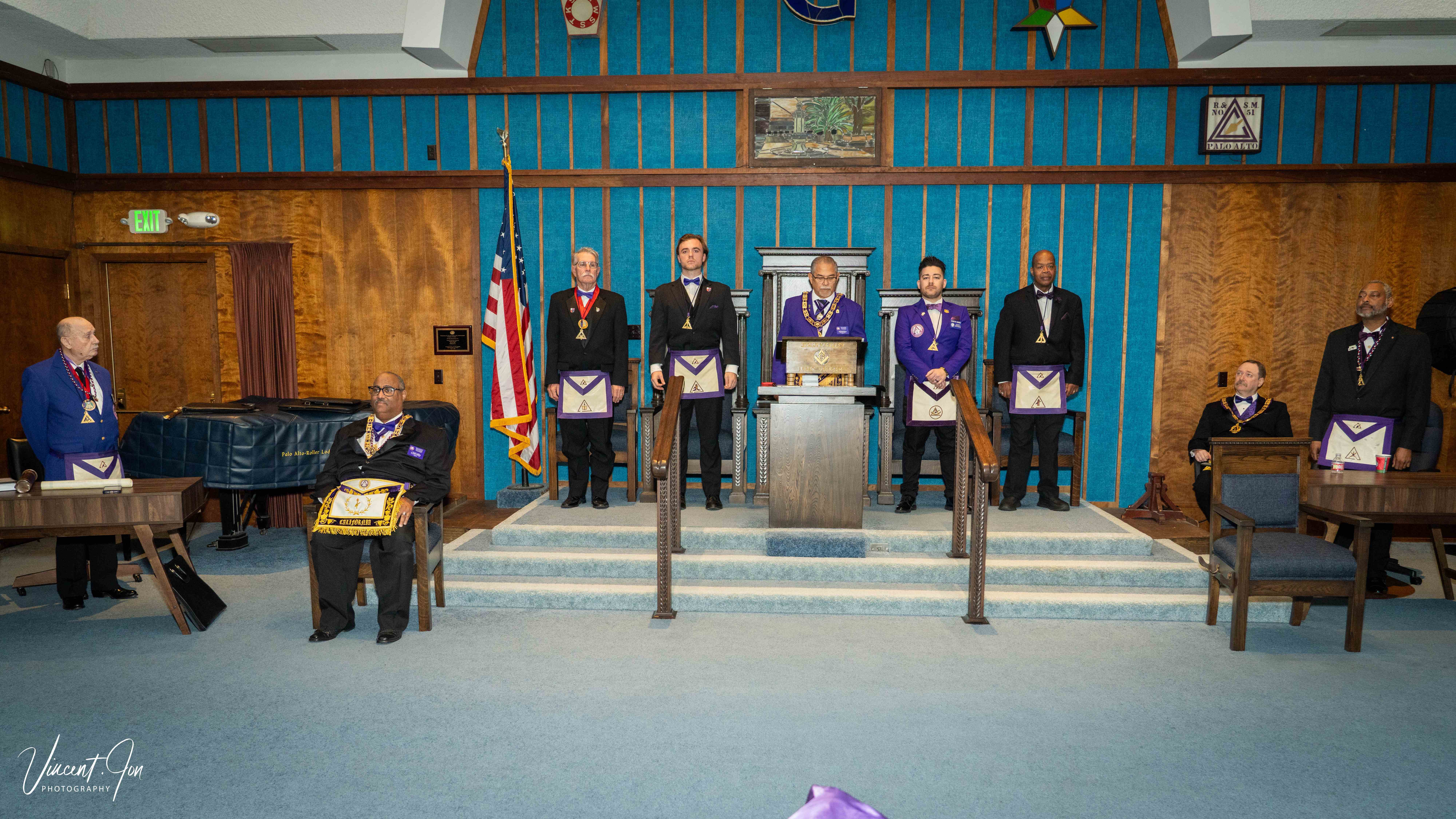Palo Alto Council No. 51 officers standing at their stations in the lodge room during a formal ceremony